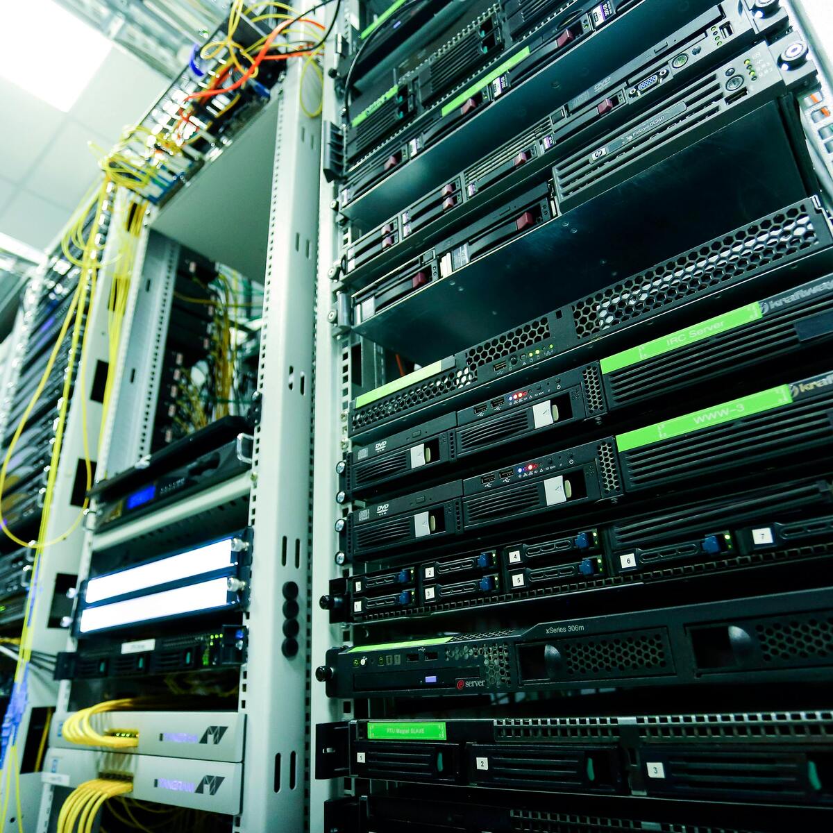 Blue-lit data centre server racks