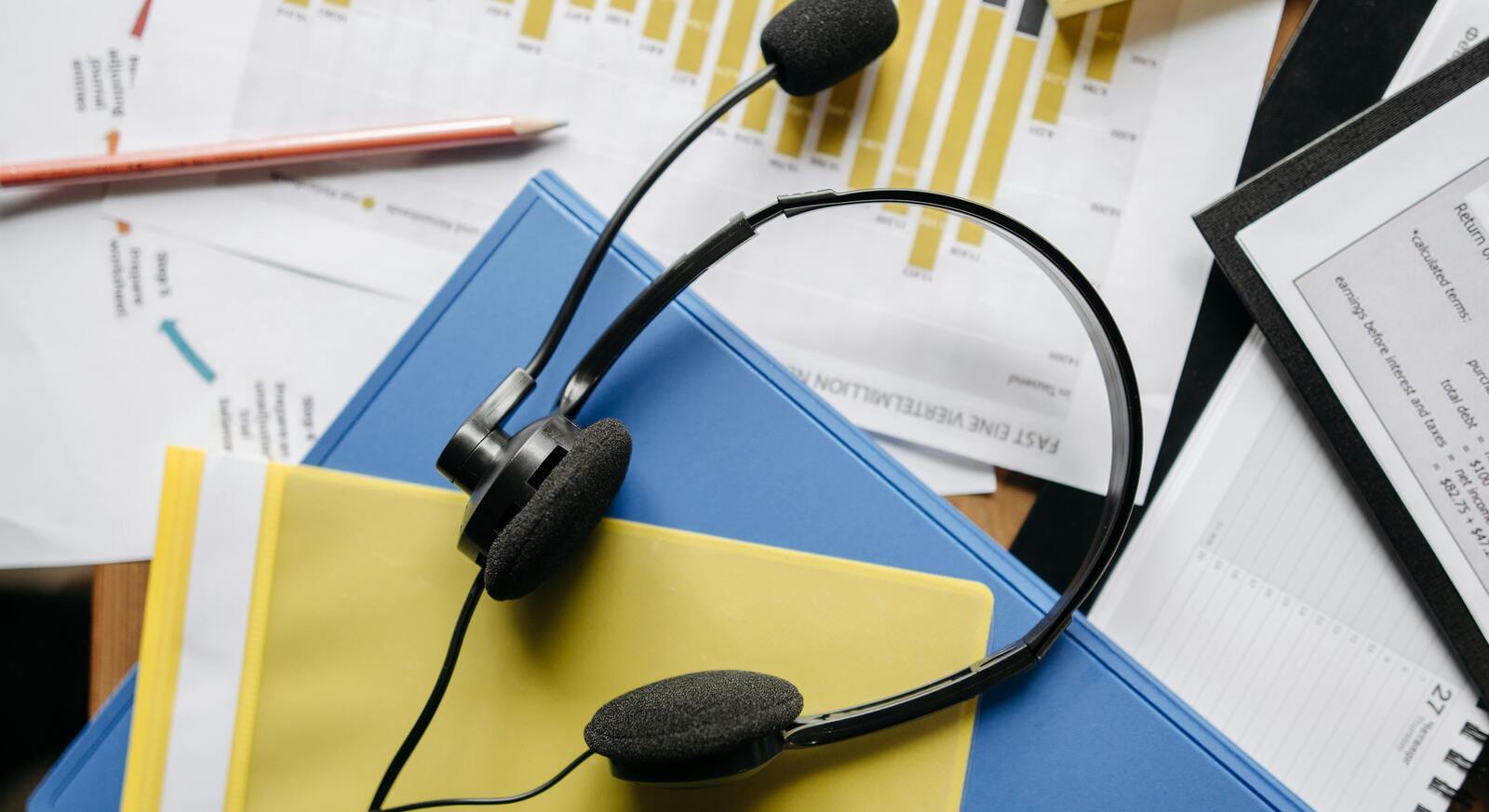Business voice solutions workspace with headset and laptop