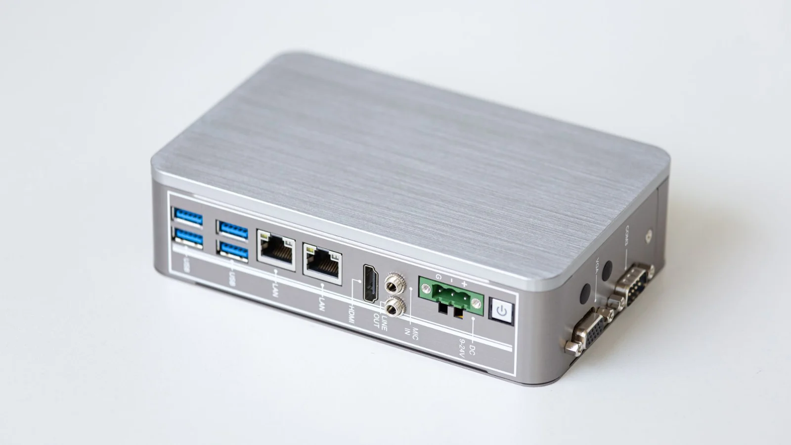 A silver business router with its network ports facing out