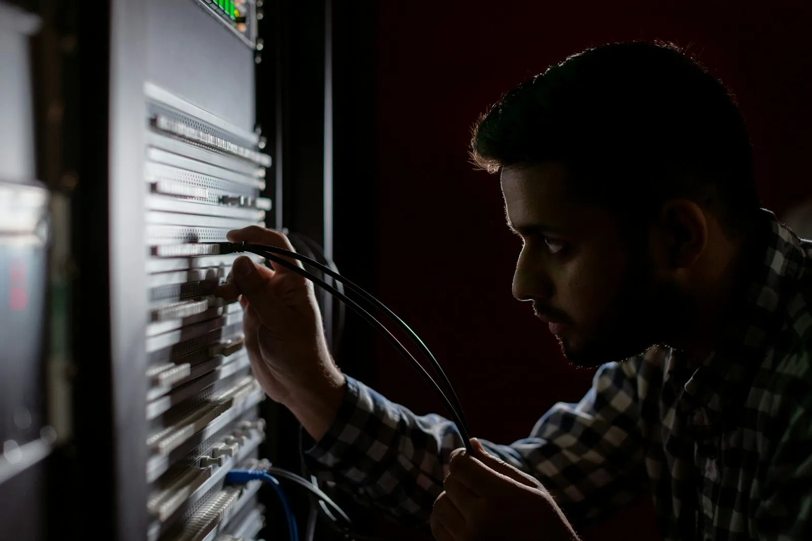Technician working on a server rack