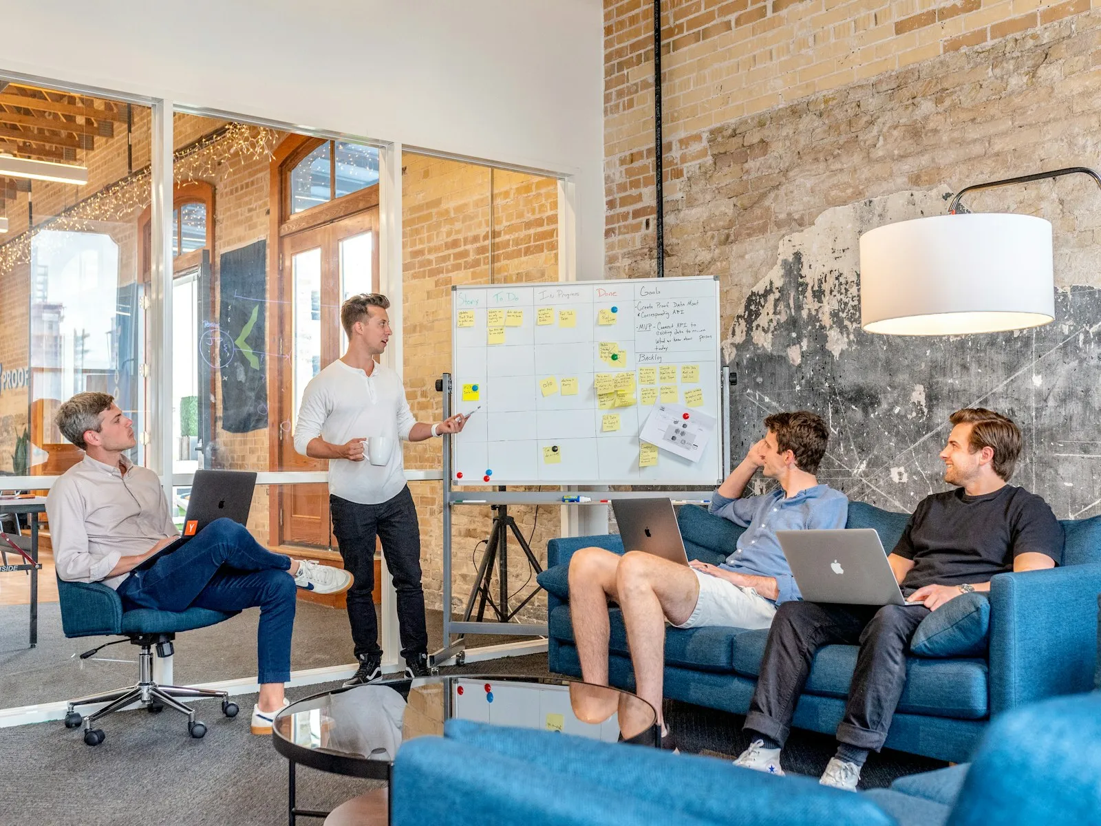 Marketing team planning a campaign at a whiteboard