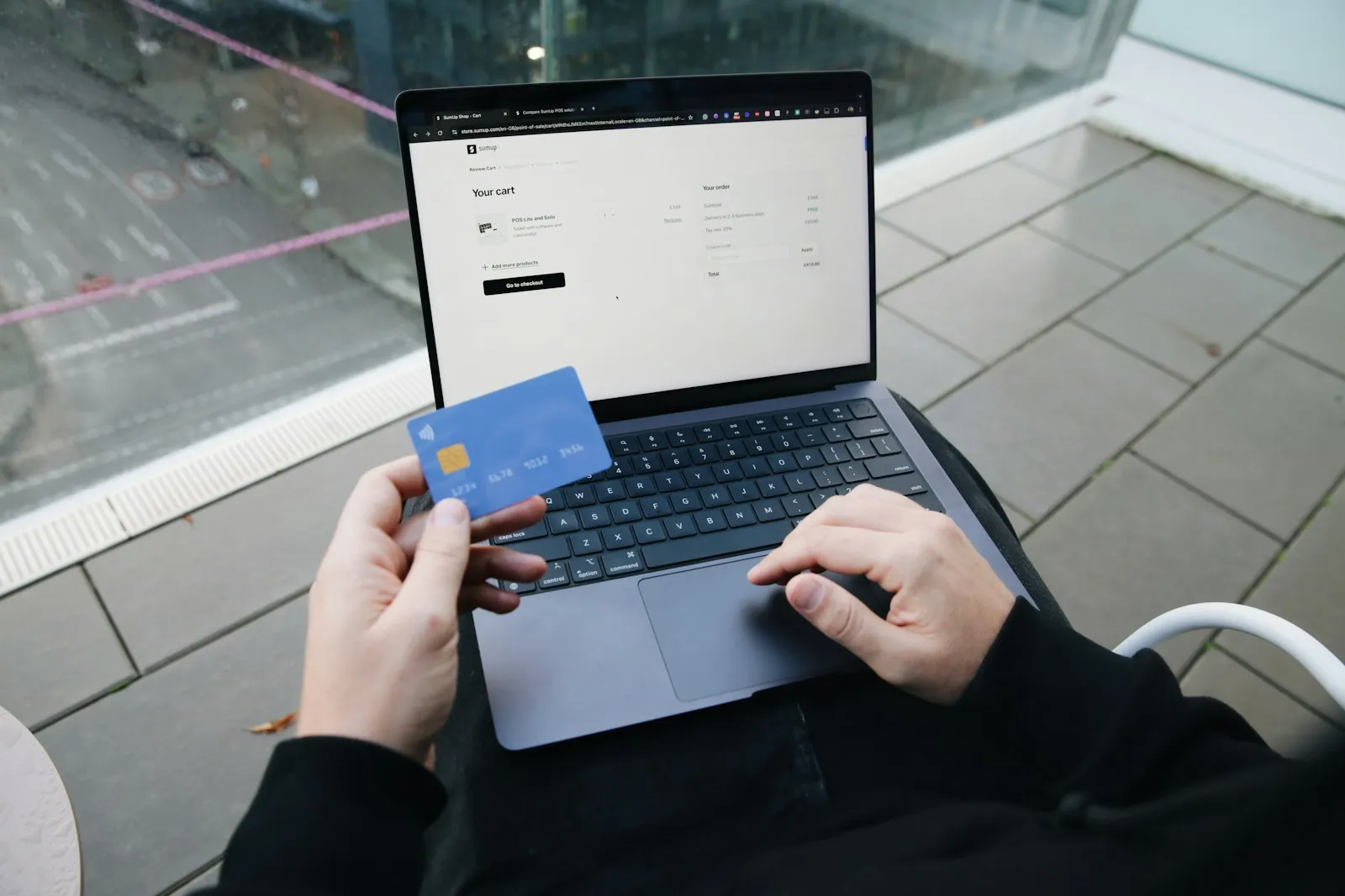 Customer paying online with a credit card on a laptop