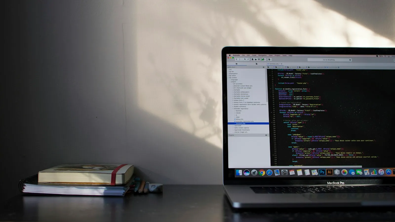 Laptop showing code on a developer desk